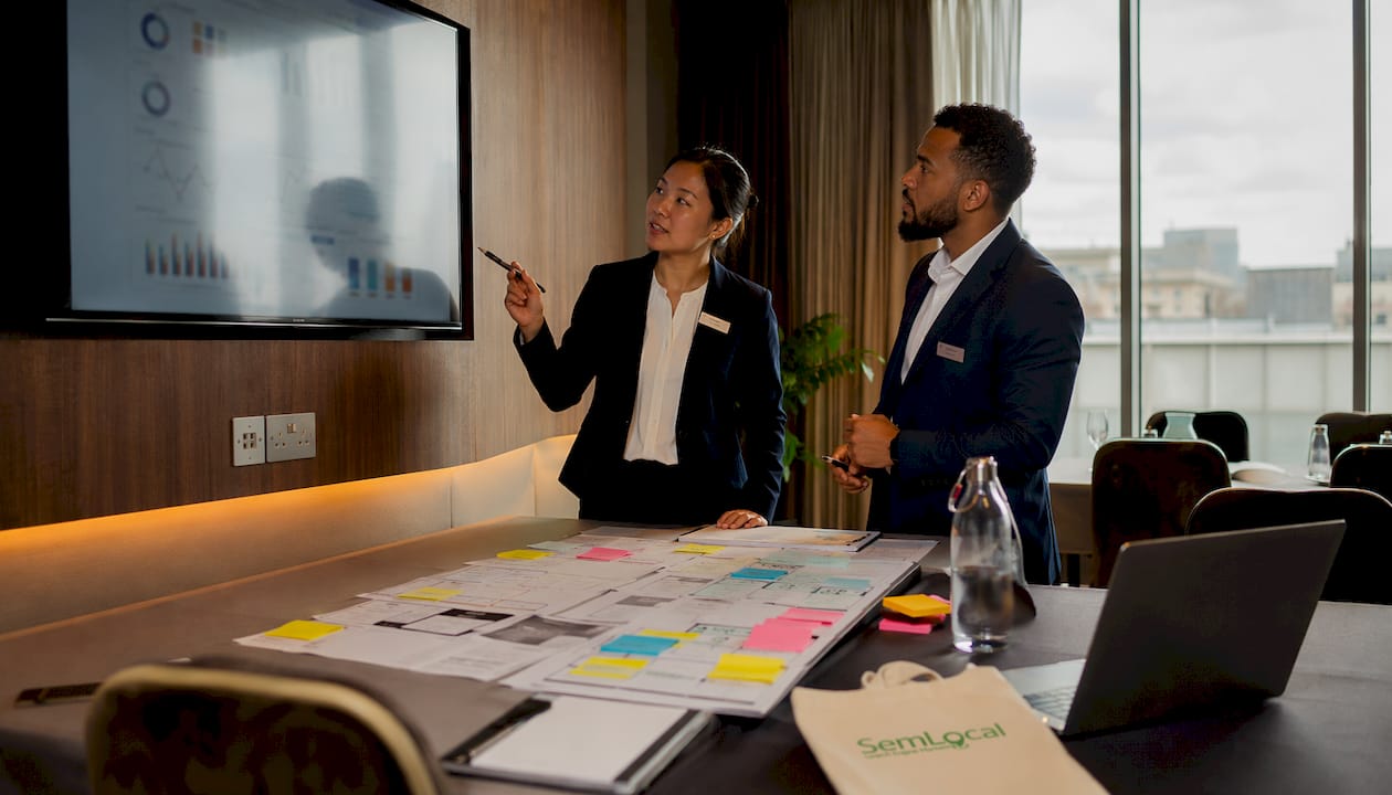 Hotel staff collaborating on automation tasks
