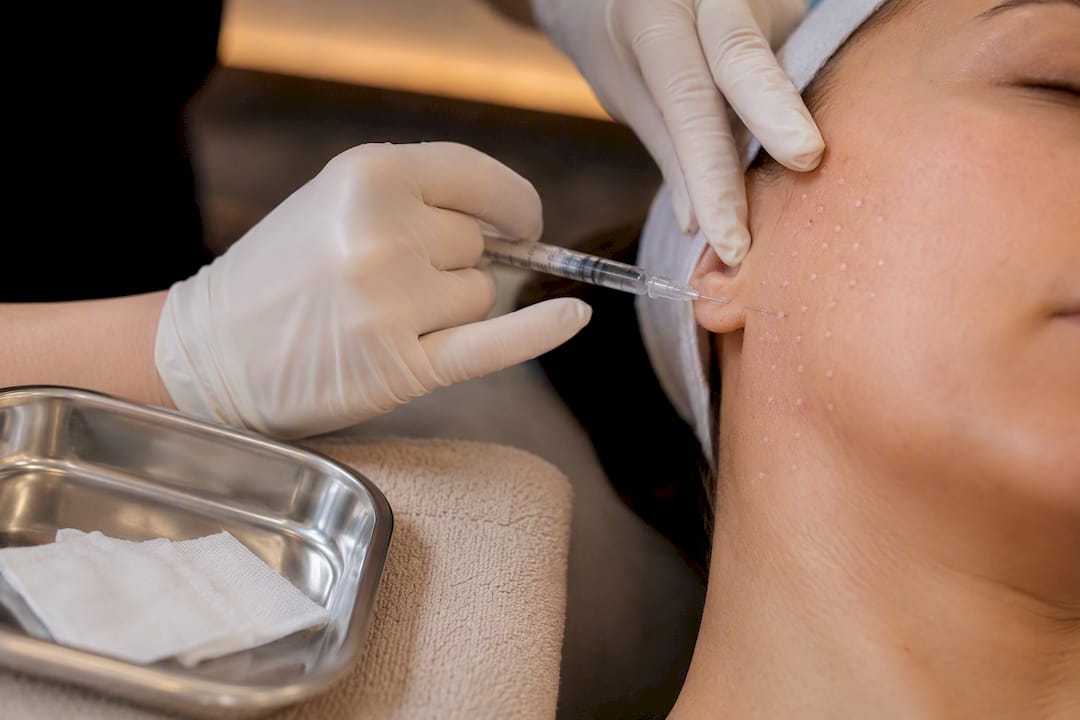 Clinician performing cheek micro-injections