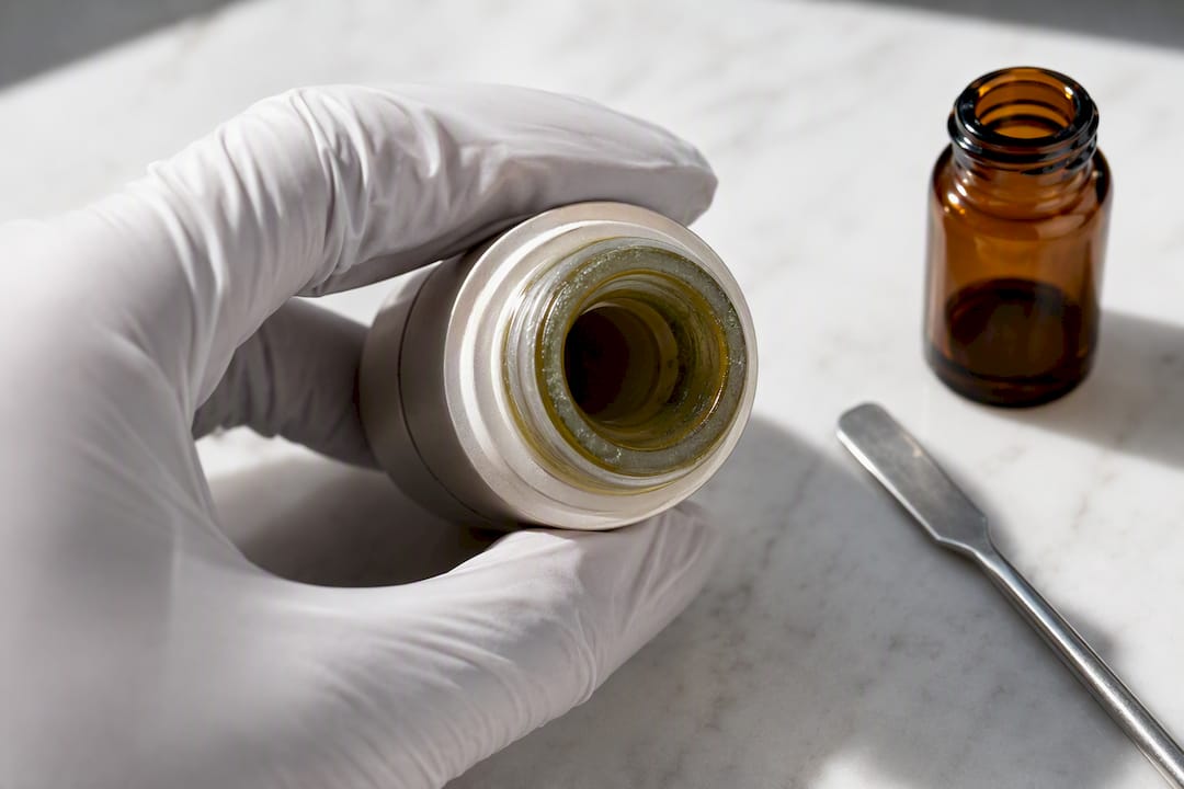 Discolored film on serum container
