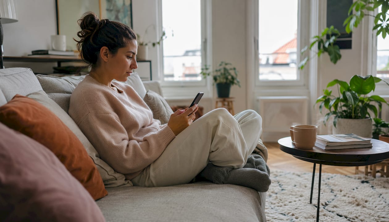Hands scrolling dating profiles on smartphone