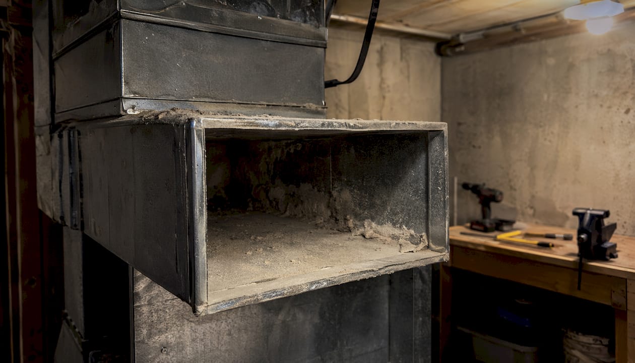 Dust buildup inside HVAC duct close-up