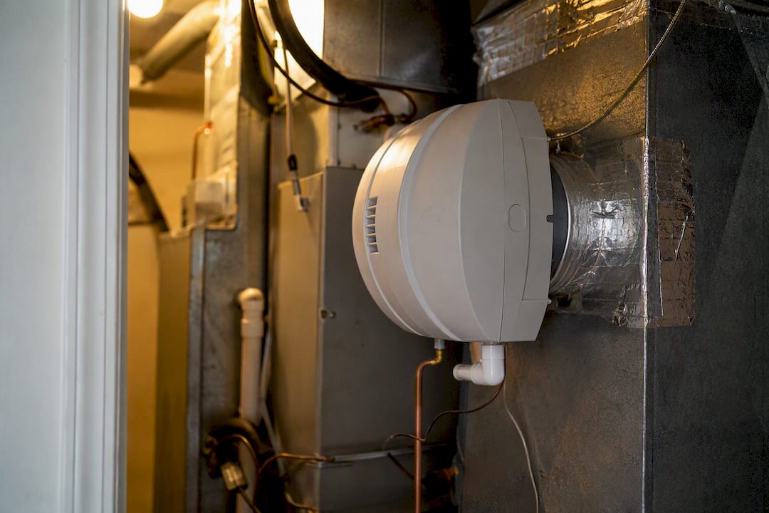 Whole-home humidifier integrated into duct system