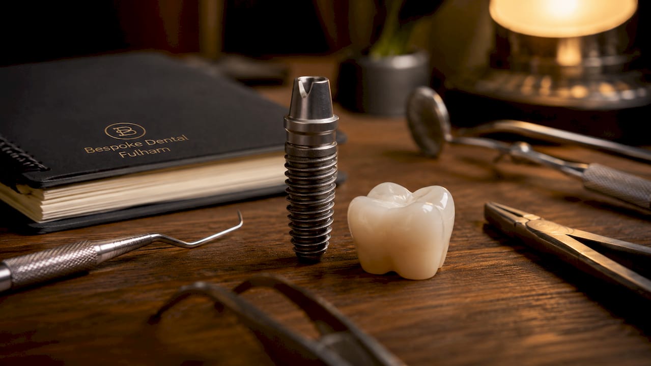 Close-up of titanium dental implant and tooth model