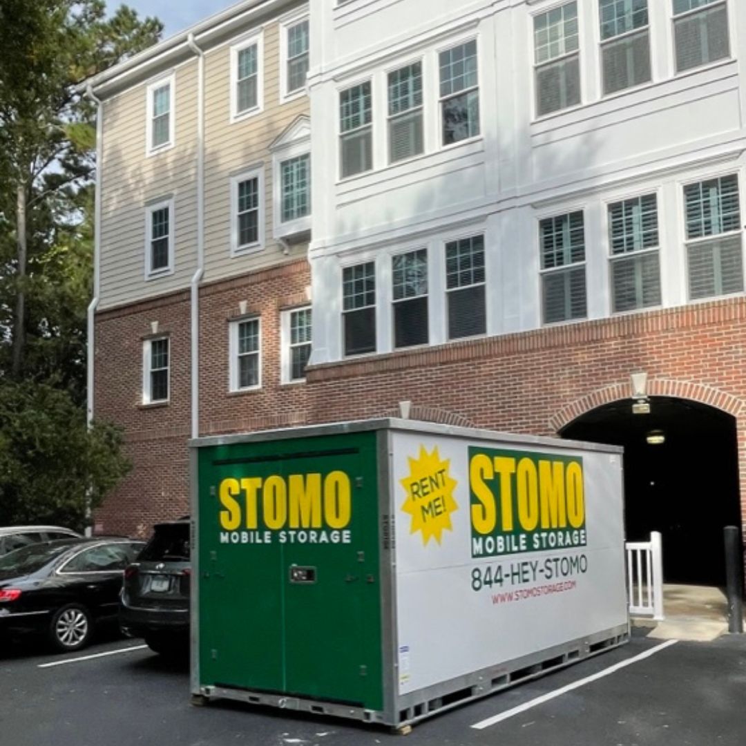 Couple organizes labeled boxes in secure South Carolina storage facility