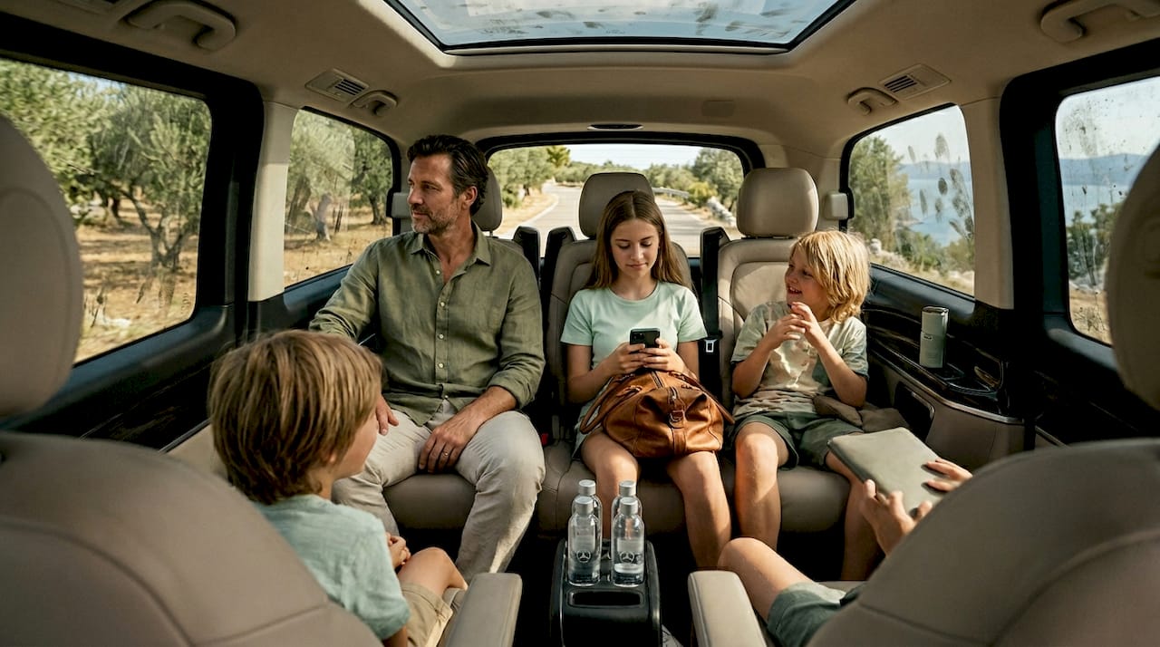 Family relaxing in luxury Croatian transfer van