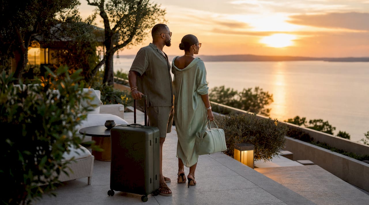 Couple entering luxurious hotel lobby