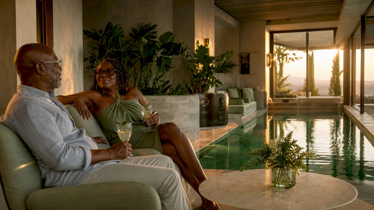 Couple enjoying private luxury villa pool