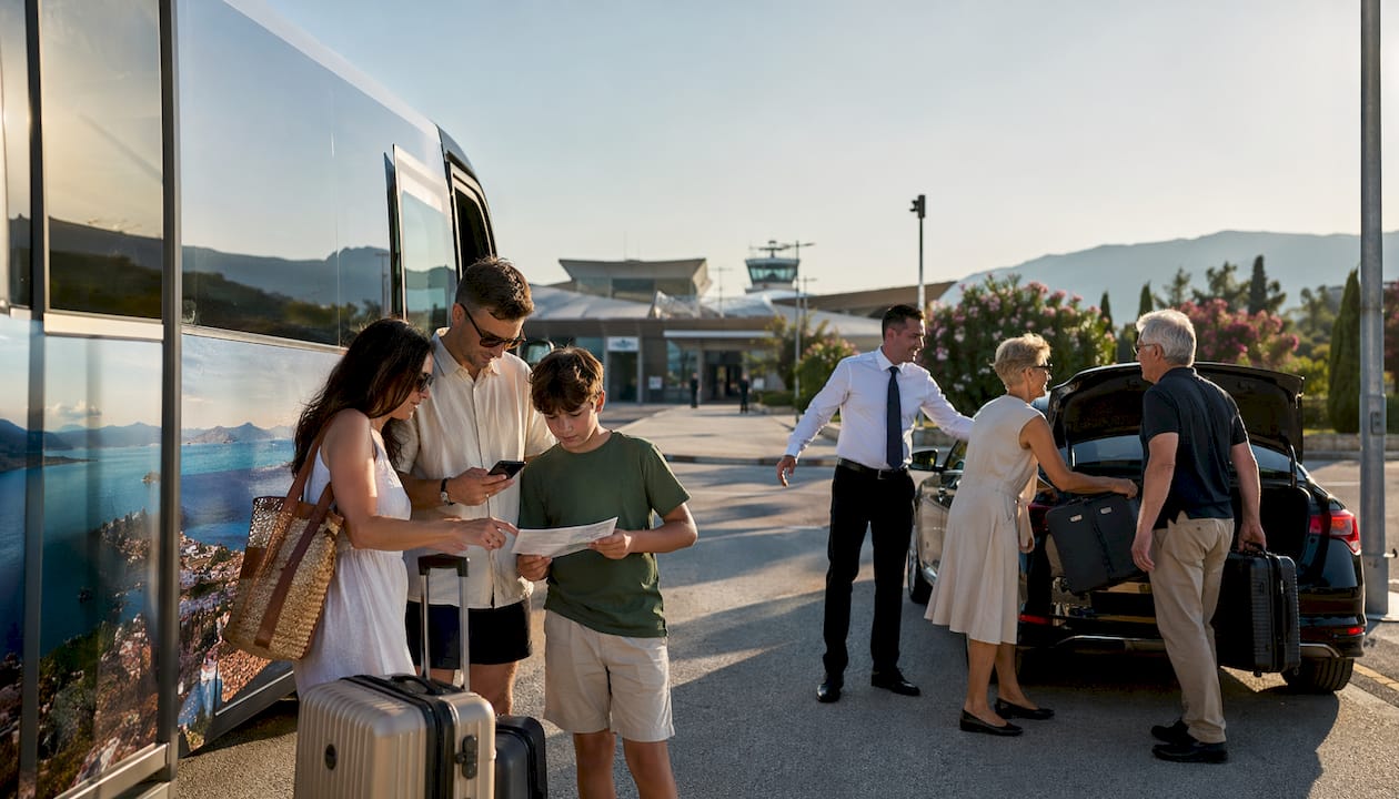 Travelers comparing transfer options at Split Airport shuttle stop