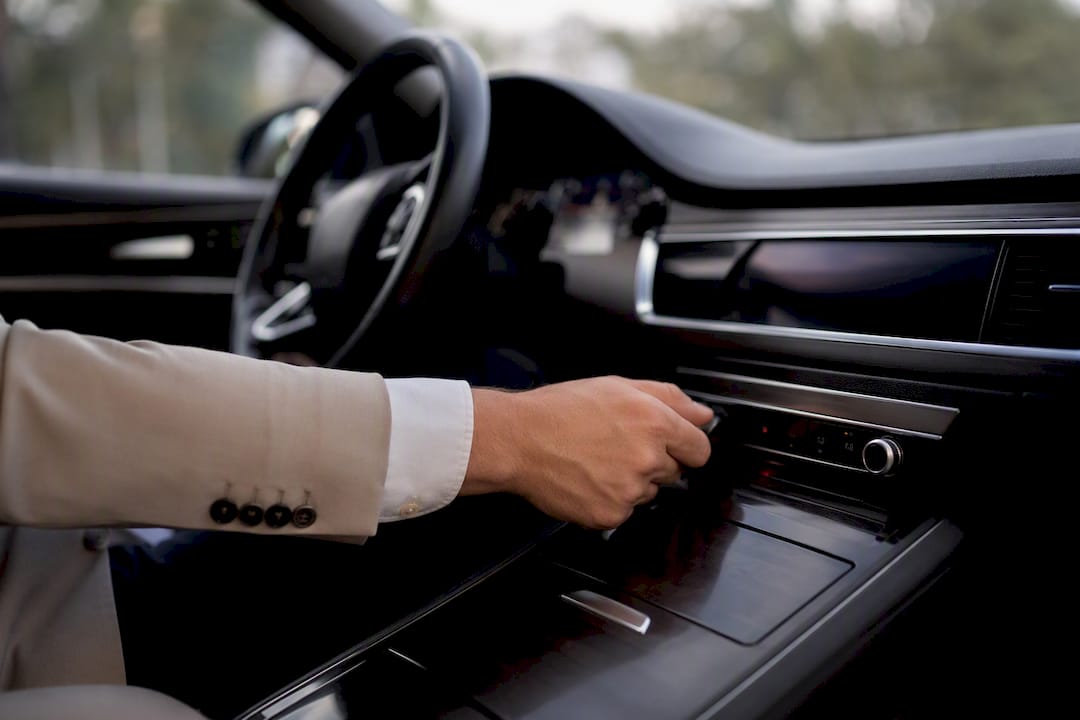 Driver adjusting air conditioning panel