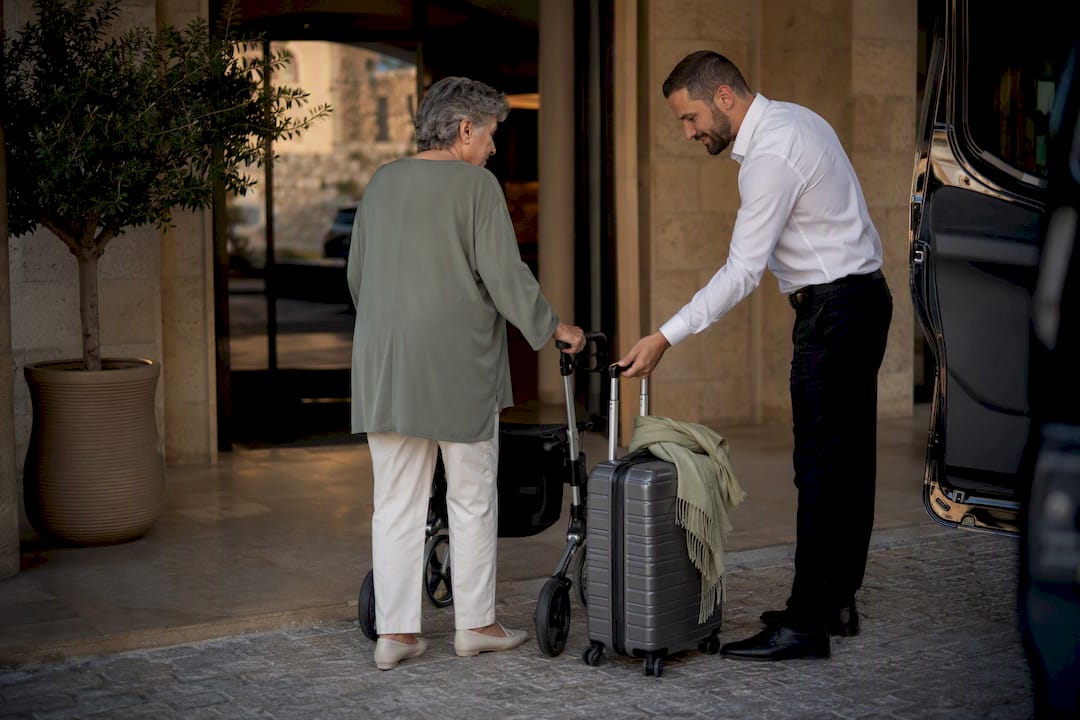 Driver assisting traveler with mobility needs