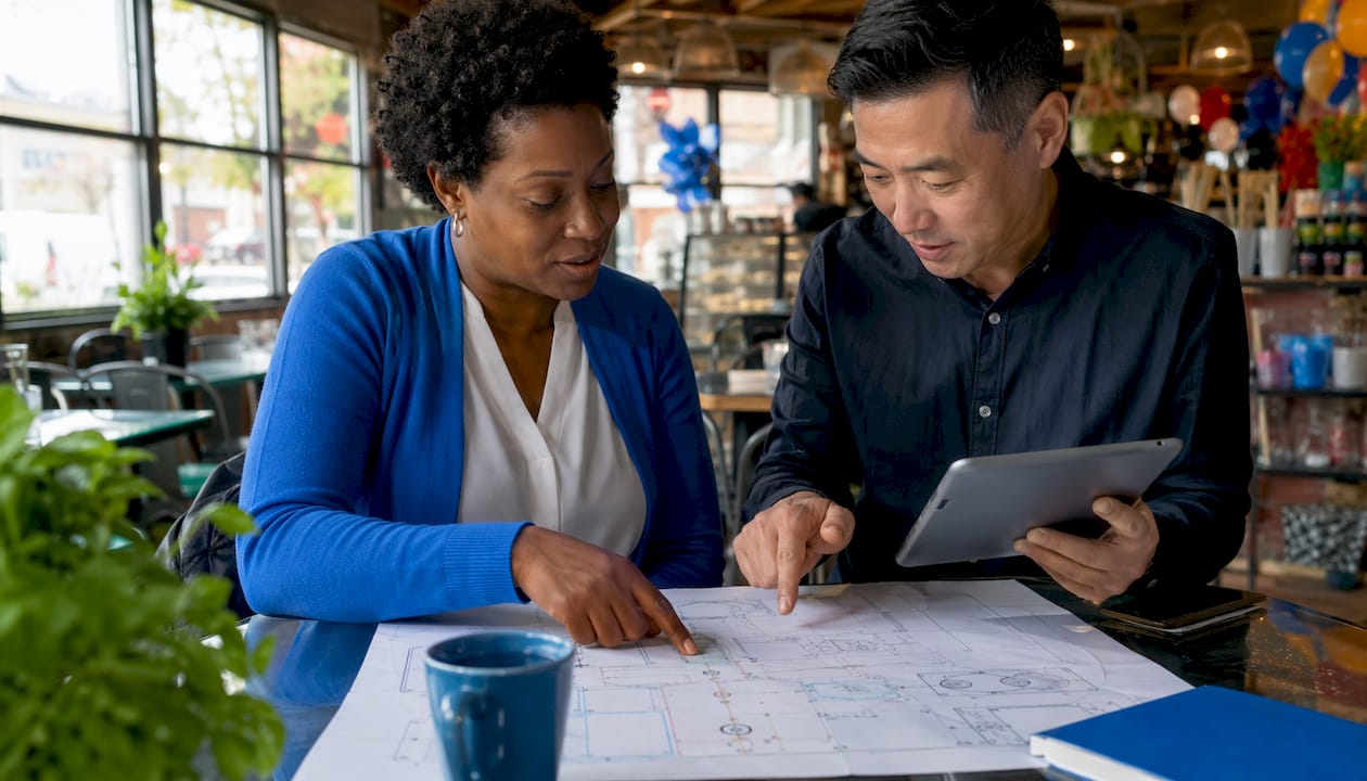 Event planners reviewing temporary power plan together