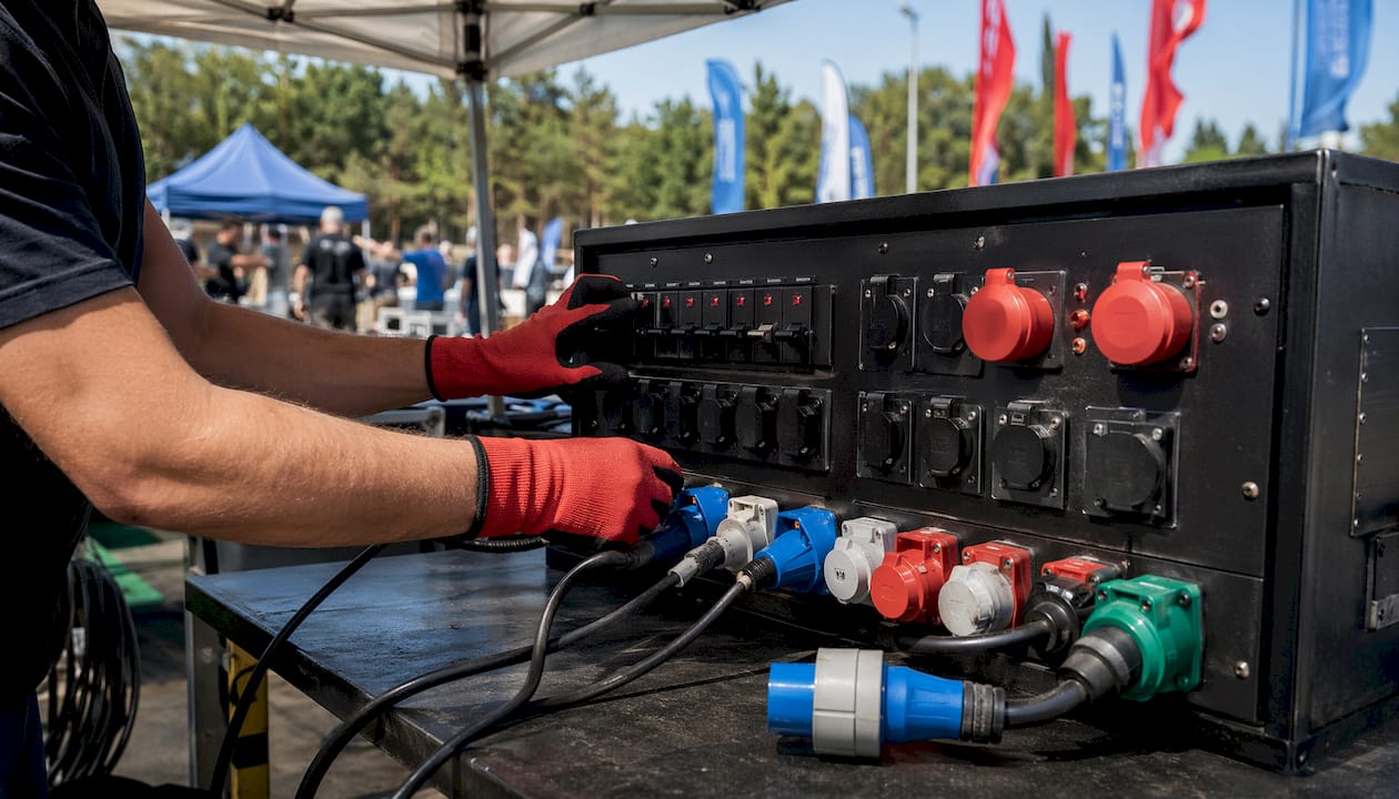 Close-up of hands adjusting power control panel
