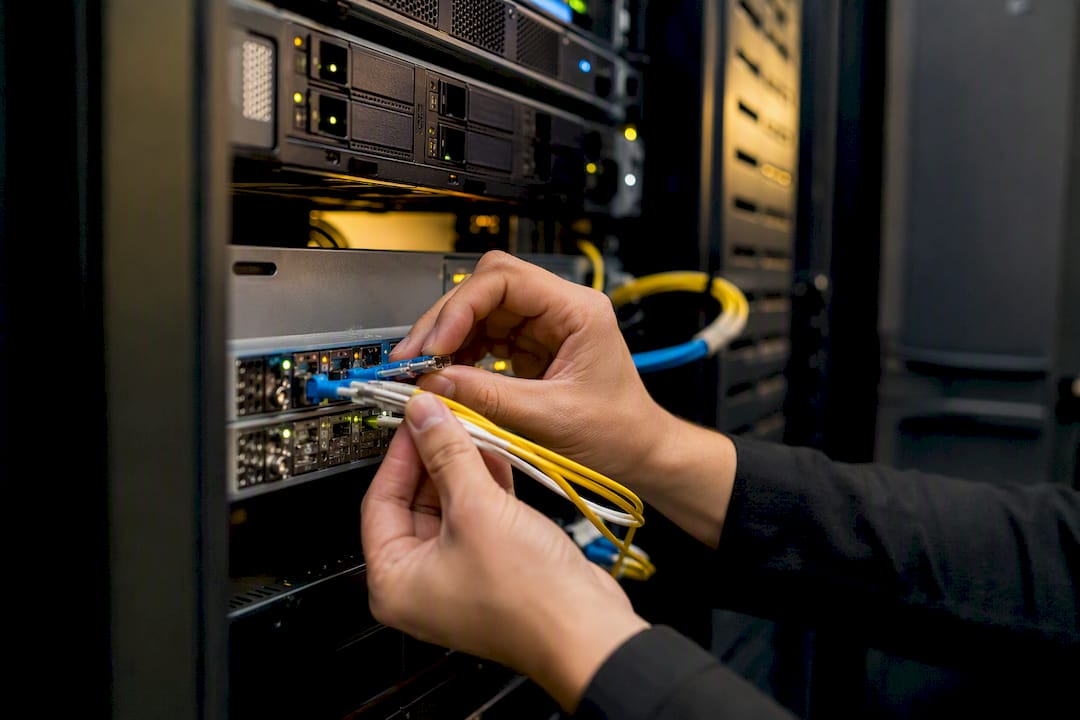 Hands configuring cloud data replication hardware