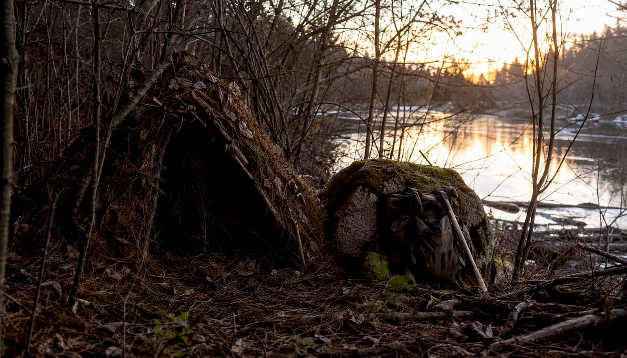 Insulated natural debris survival shelter side view
