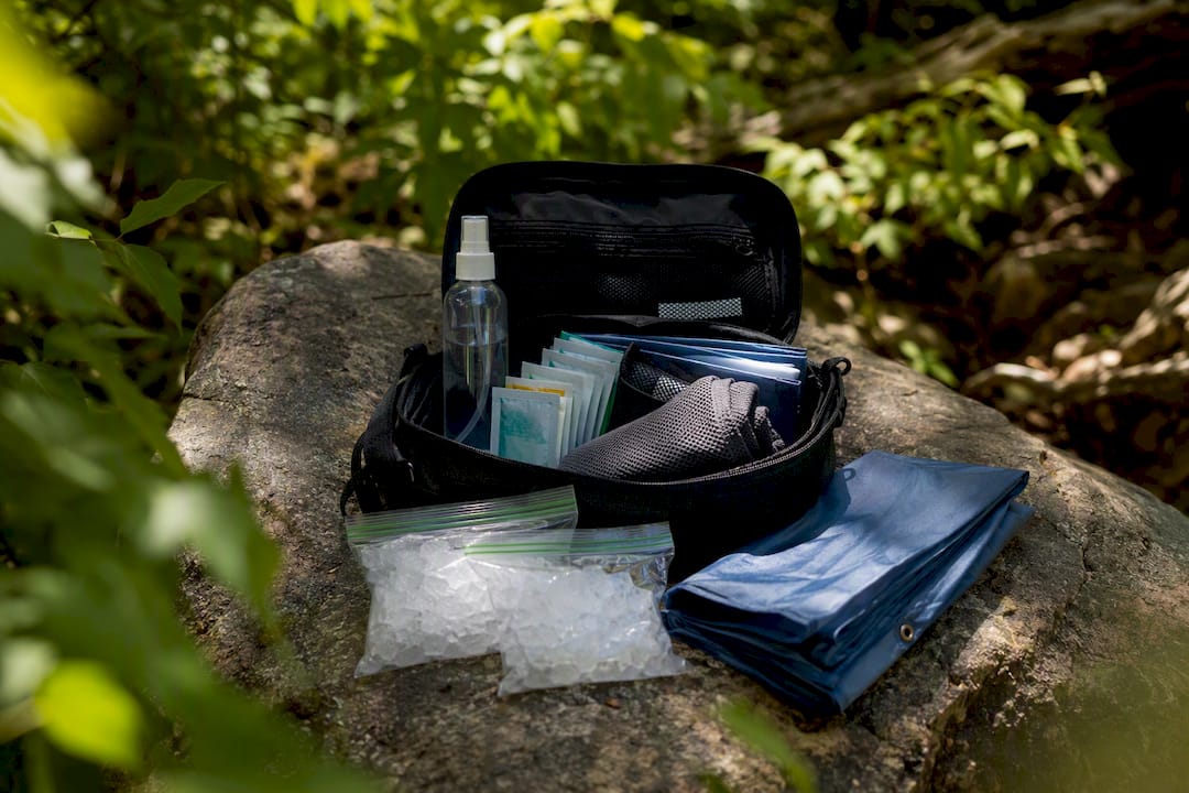 Heat exhaustion first aid kit laid out outdoors