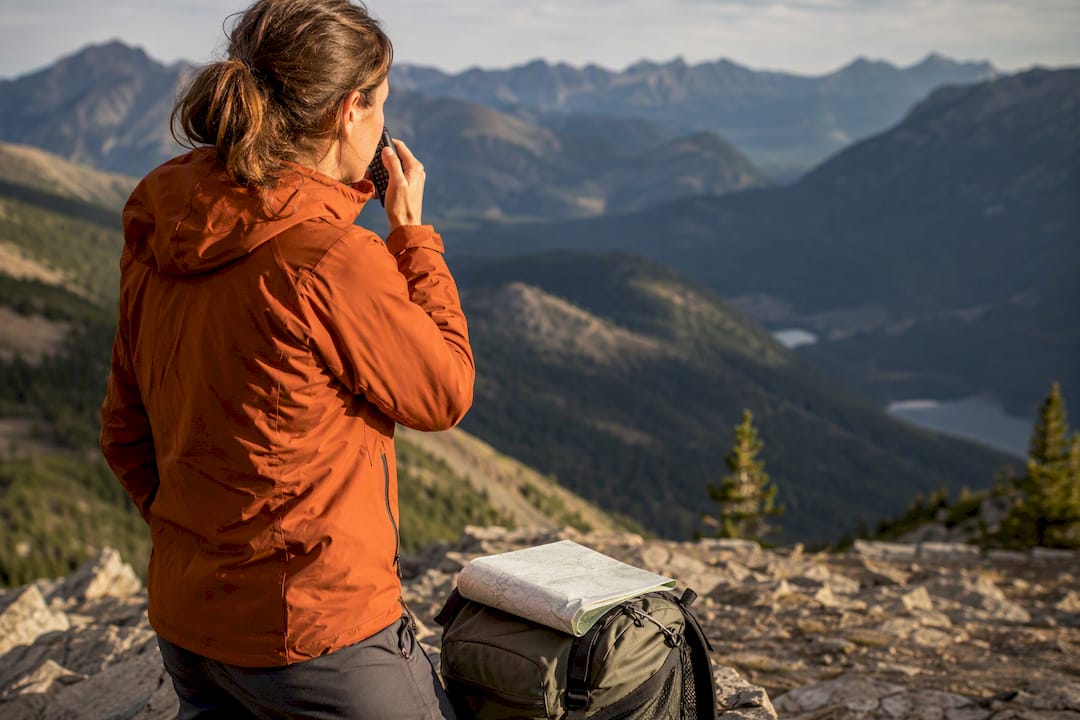 Hiker reporting coordinates by radio