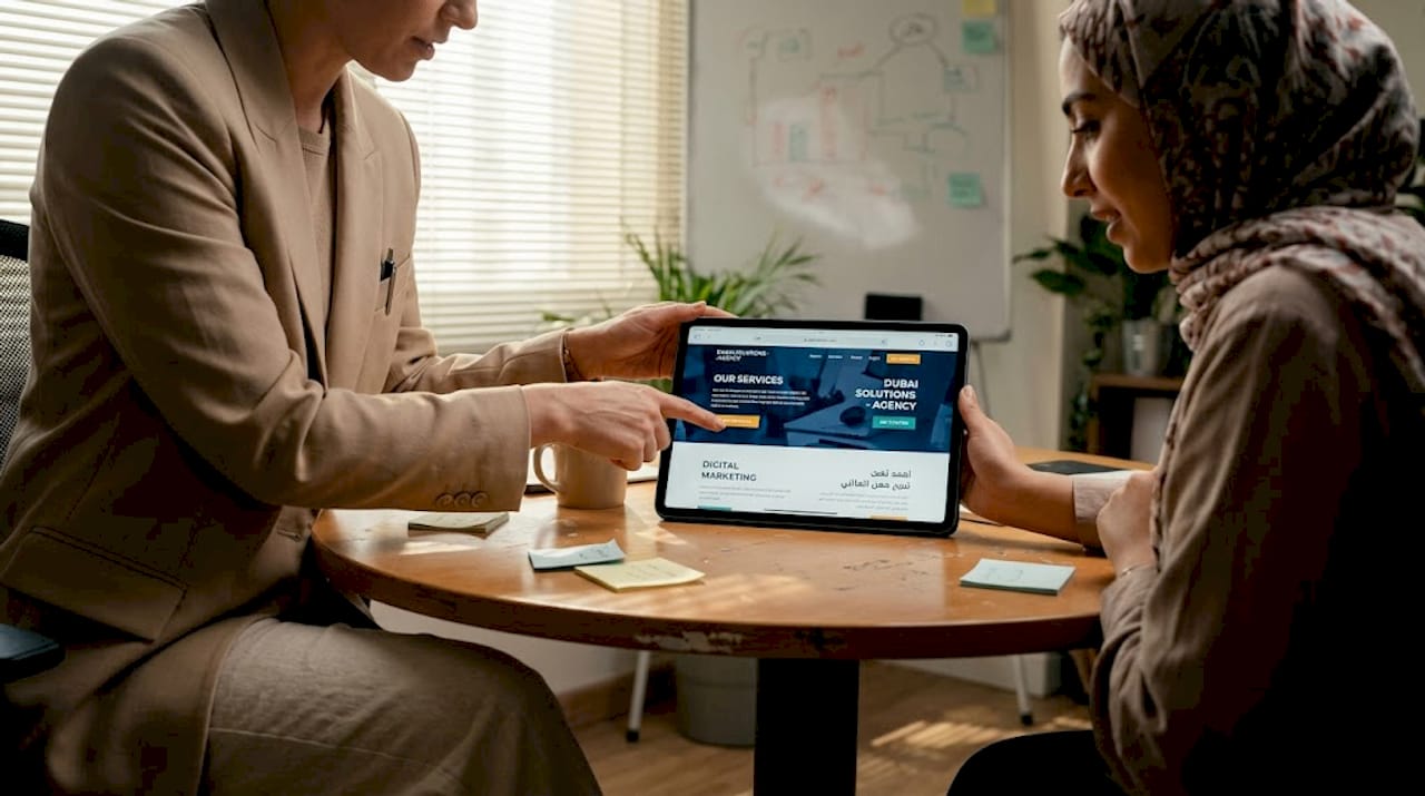 Team reviewing bilingual website interface