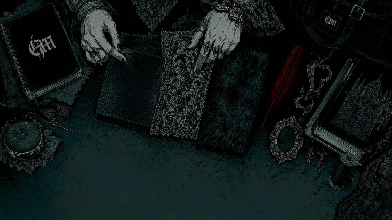 Hands arranging goth grunge fabric swatches