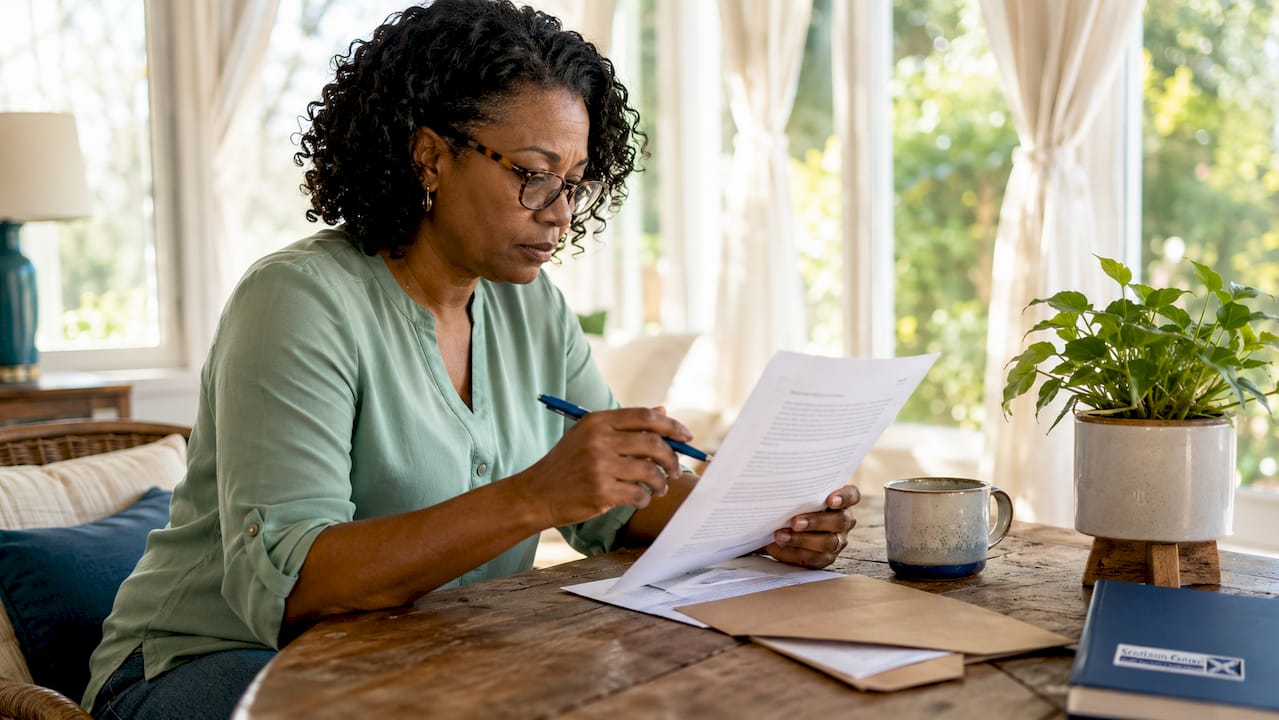 Client reading zero success fee agreement at home