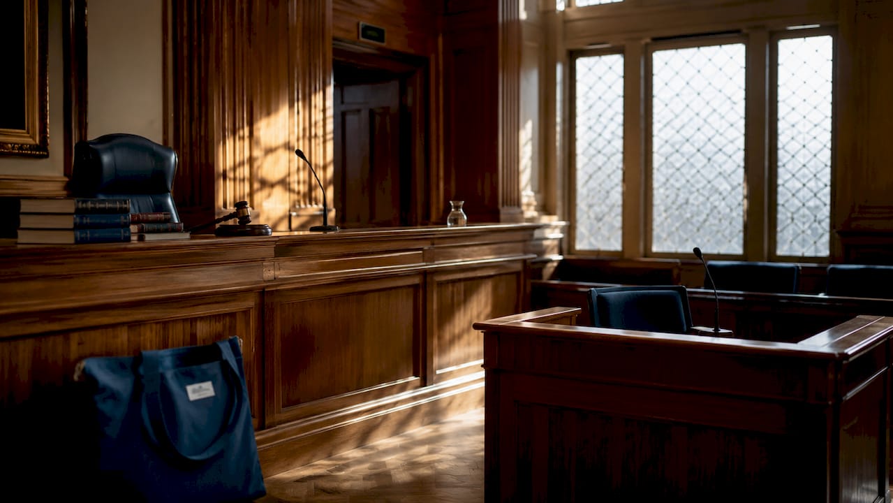 Empty Scottish courtroom with judge’s bench