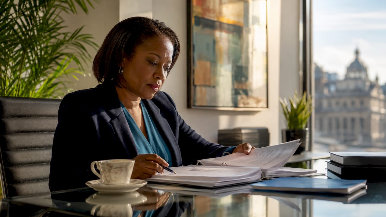 Solicitor reviewing legal documents in Glasgow office