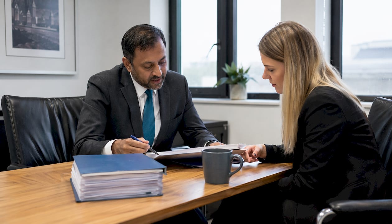 Solicitor advising client on injury claim process