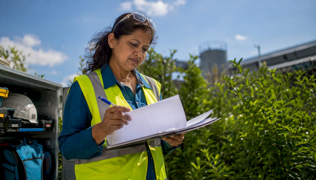 Safety officer reviewing accident documents
