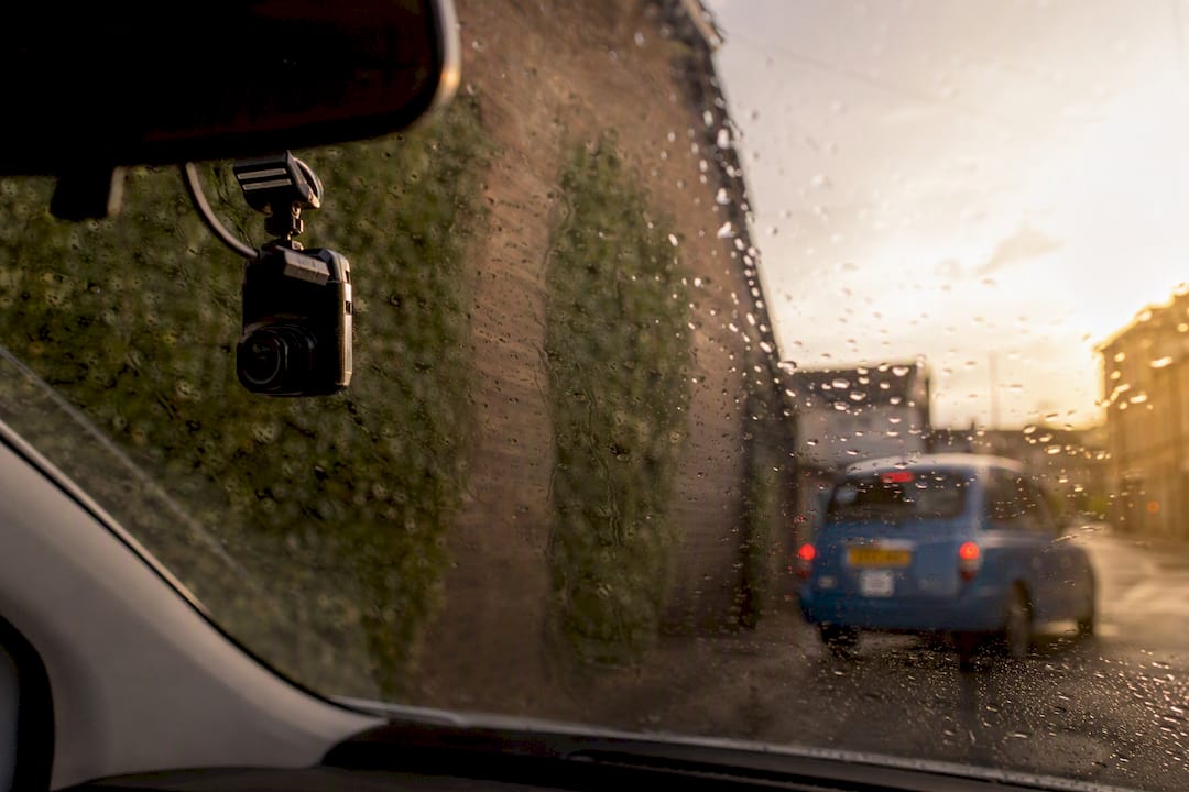 Dashcam device inside car windshield