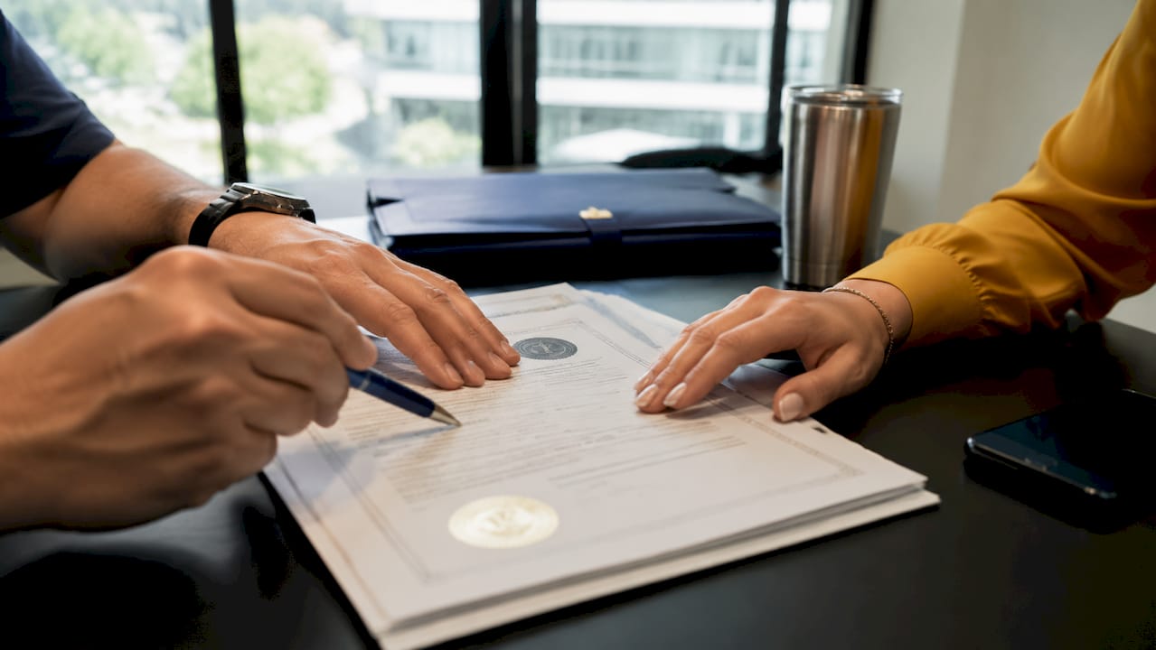 Close-up hands checking contractor certifications