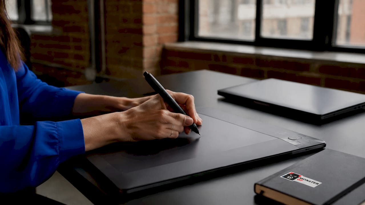 Designer hands using tablet for website design