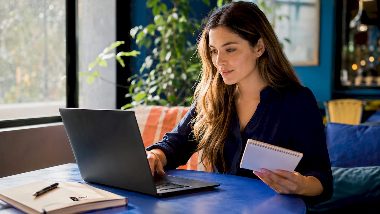 Hands working on PPC campaign on laptop