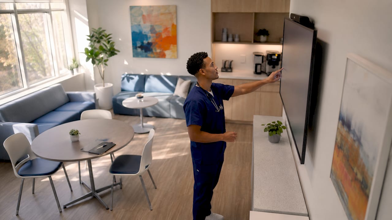 Healthcare worker reviewing EHR in office