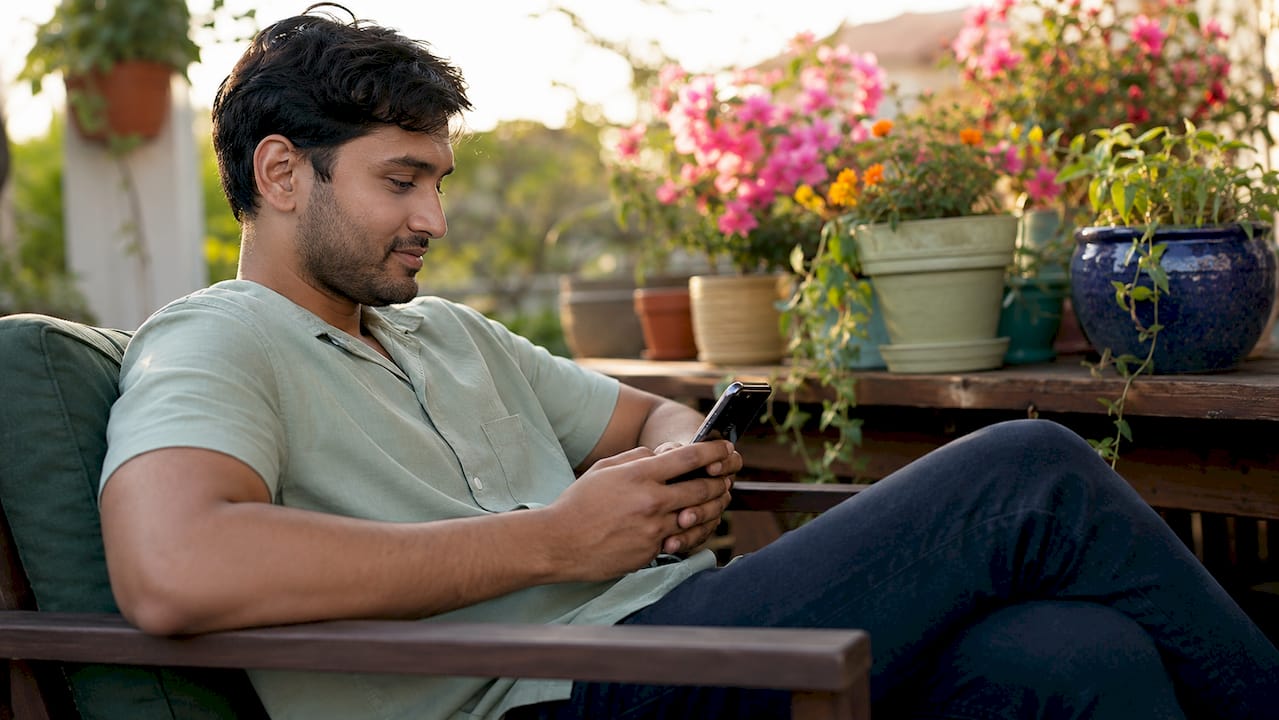 Man using symptom checker app on phone