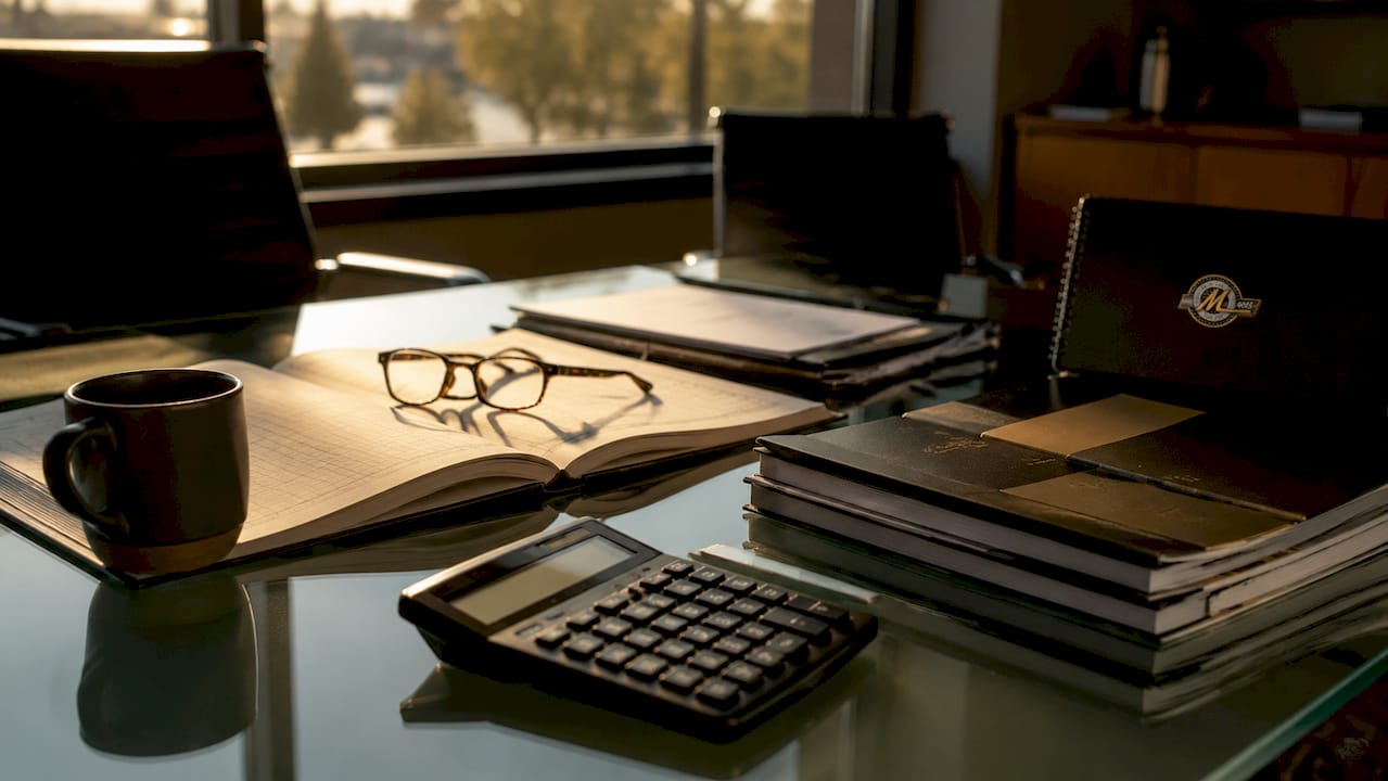 Business assets and financial tools on meeting table