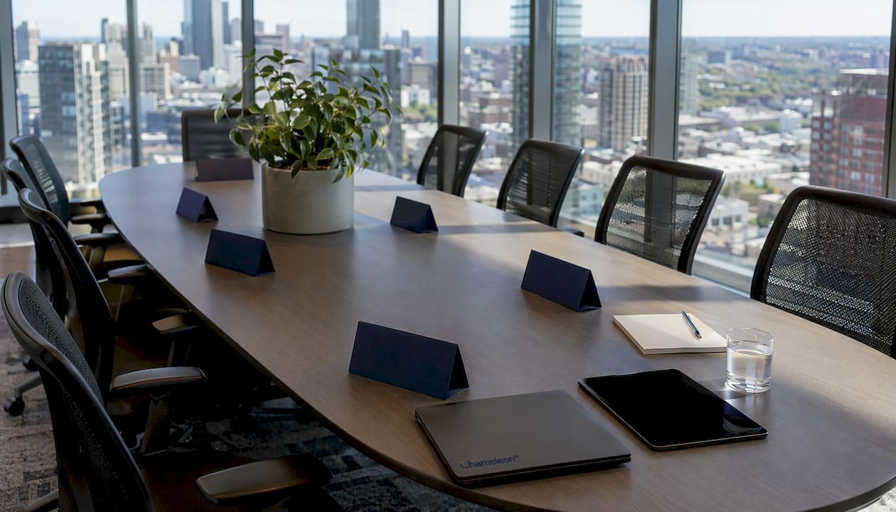 Unoccupied conference table with compliance role placards