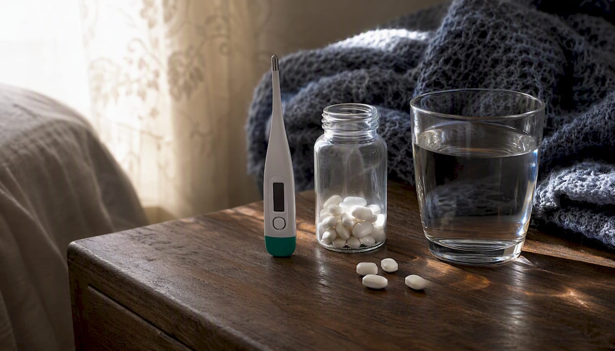 Fever care items on bedside table