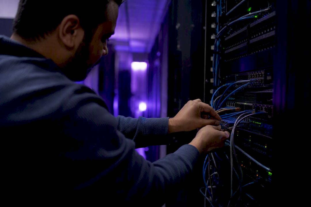 Developer adjusting network cables for web performance