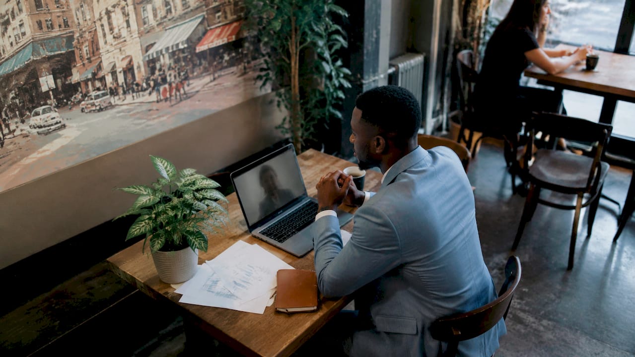 Businessman in office on video call