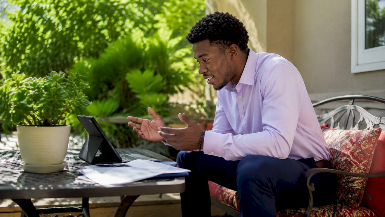 Man conducting remote online notarization at home