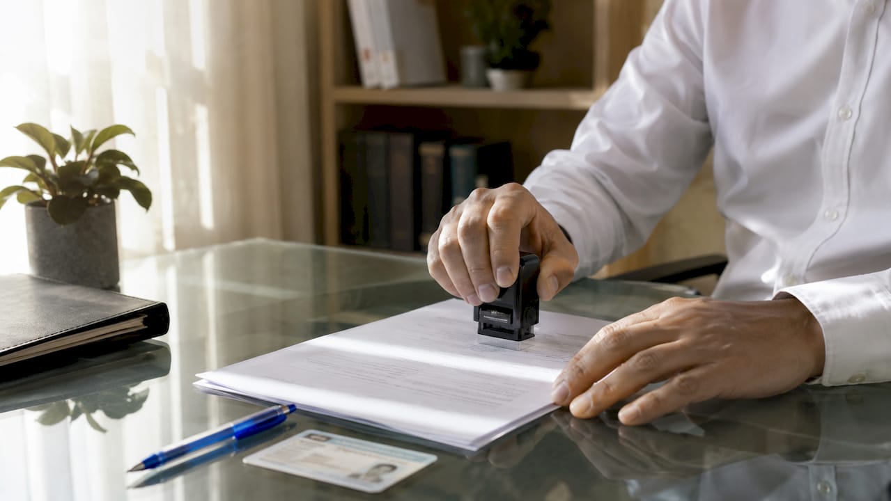 Close-up of notary stamping affidavit document