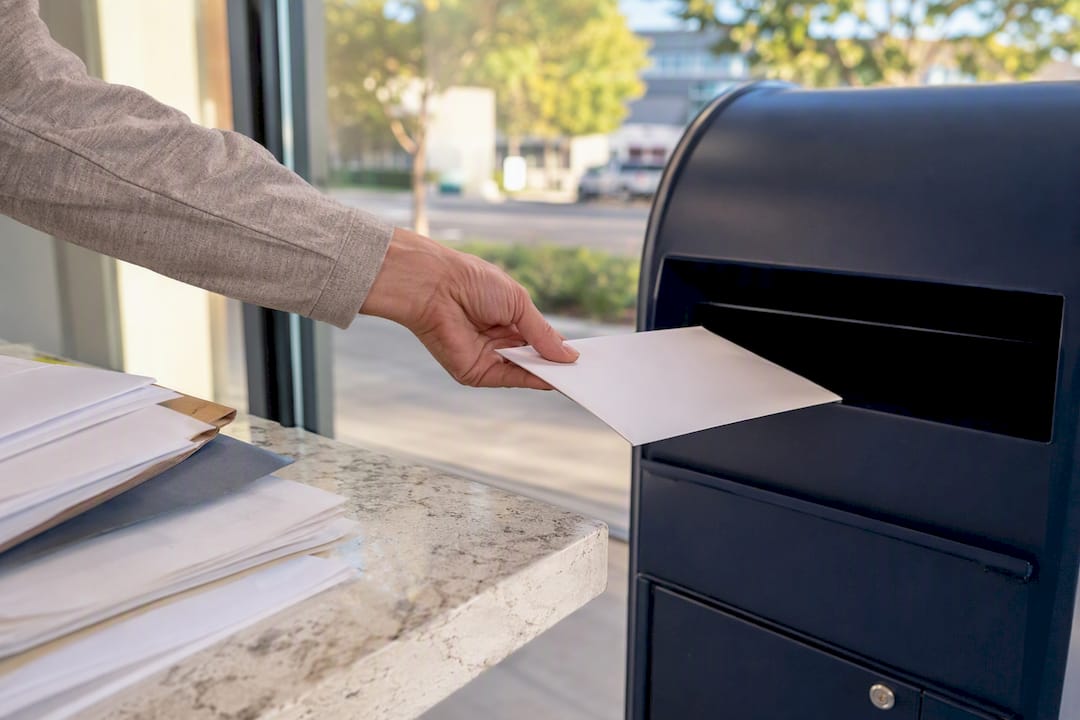 Prepaid apostille service envelope being mailed