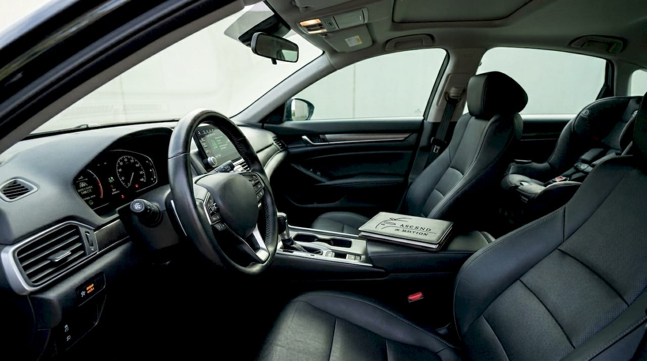 Luxury car interior highlighting safety features and child seat