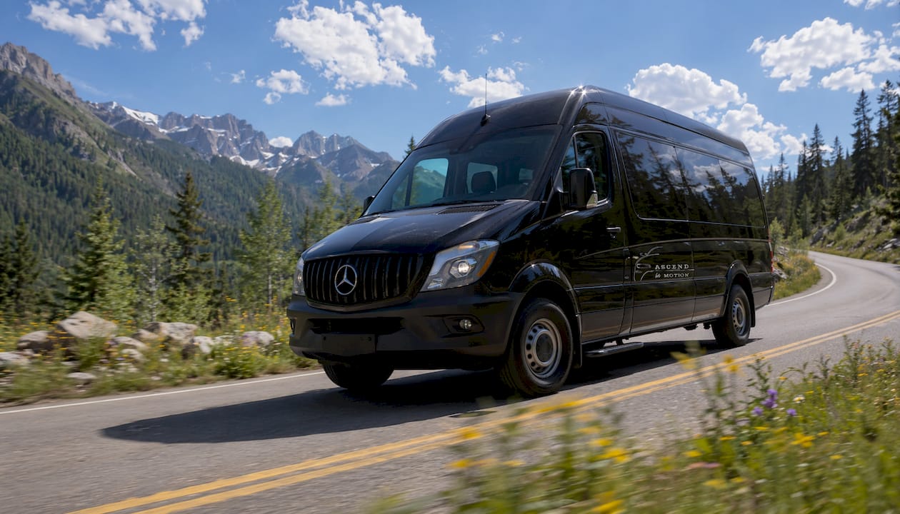 Black Ascend in Motion Sprinter van on coastal road near LA