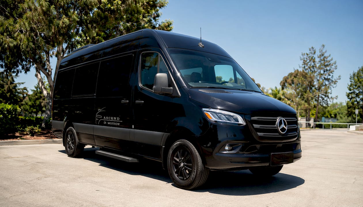 Black Mercedes-Benz Sprinter shuttle parked at airport