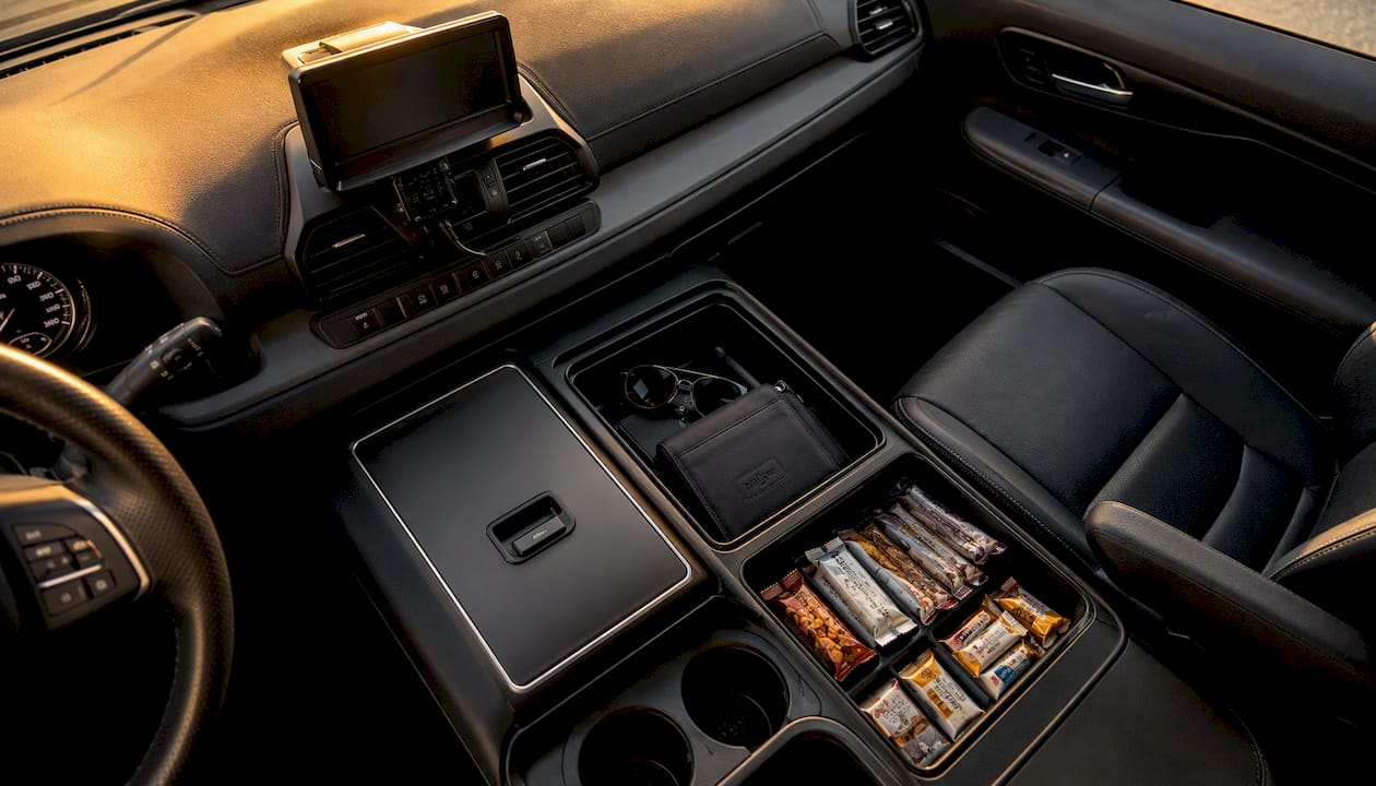 Interior of Ascend in Motion black minivan showing amenities