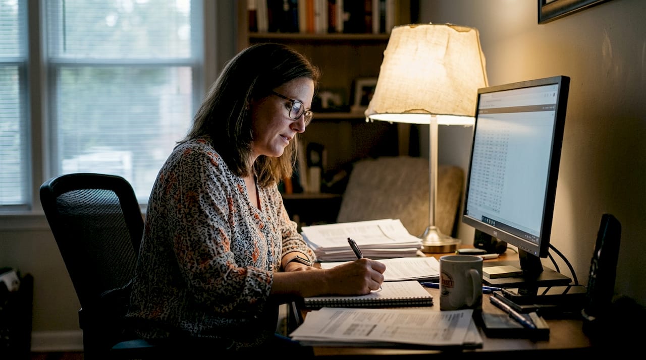 Trader reviews trade results and takes notes