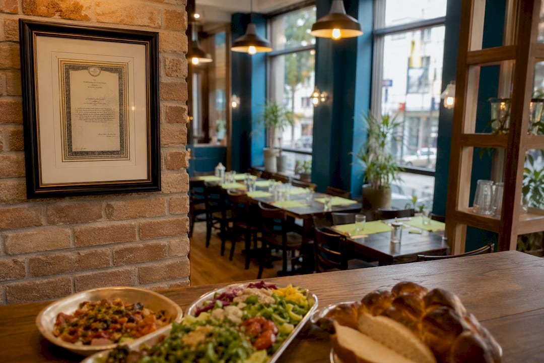 Kosher certification certificate on restaurant wall