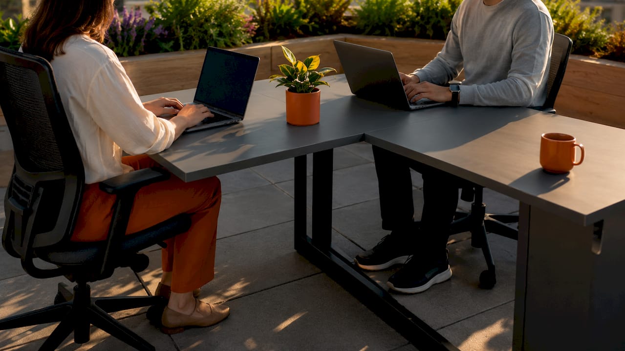 L-shaped collaborative desk side-by-side workers