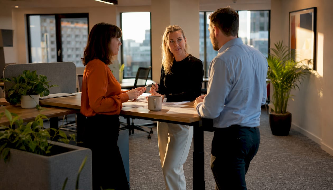 Team discussing open desking layout options