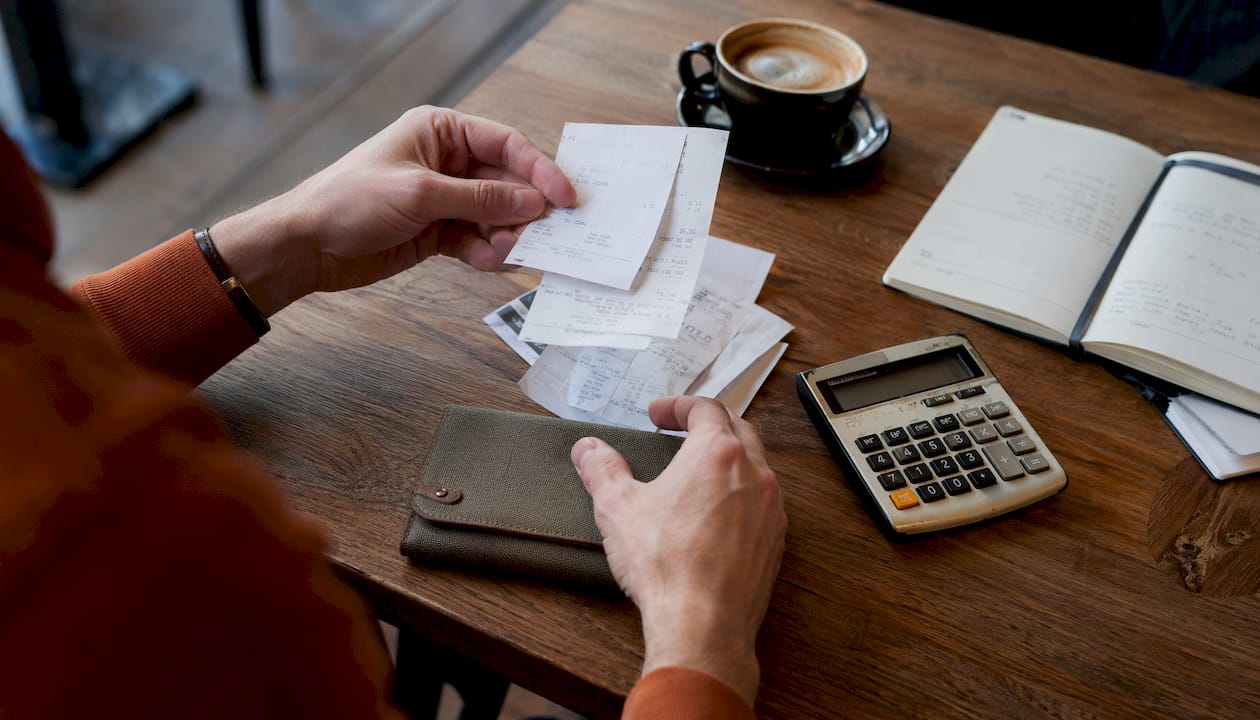Hands sorting refurbishment cost documents
